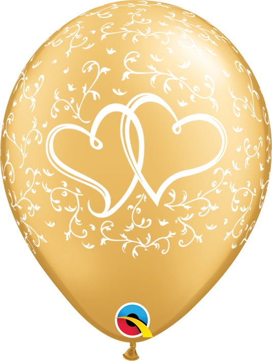 gold balloon with white entwined hearts and scrolls