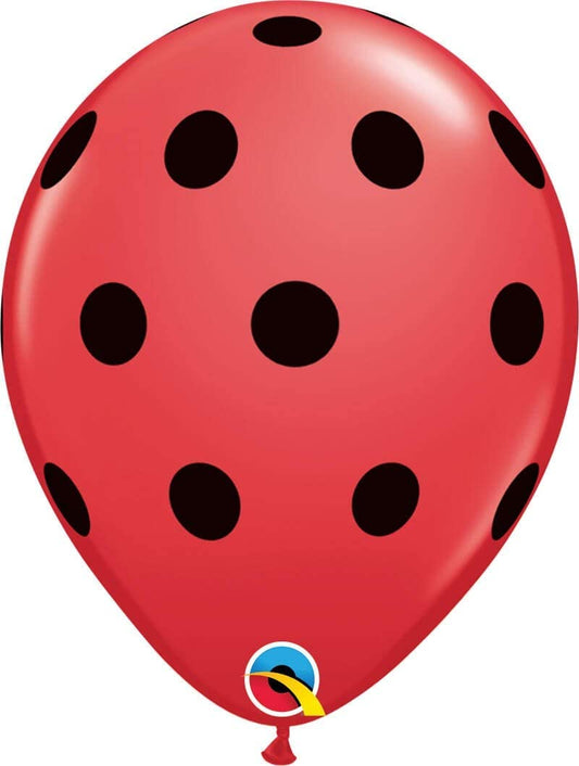 red balloon with black polka dots